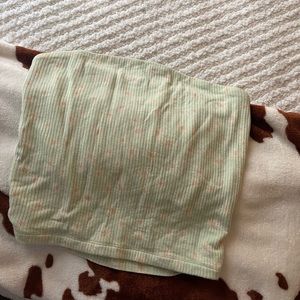 Tube top with fitting lining at the top with sunflower pattern